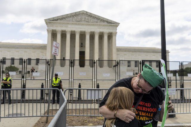 A women consoles her daughte,r as protesters gather in front of the U.S. Supreme Court in Washington, DC on Friday, June 24, 2022. The Supreme Court overturned Roe vs Wade, by a vote of 6-3, eliminating the constitutional right to an abortion after 50 years after the decision. Photo by Tasos Katopodis