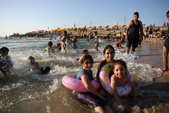 Palestinians enjoy the beach in Gaza City on Friday, June 24, 2022. Photo by Ismael Mohamad