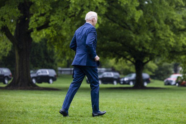 U.S. President Joe Biden departs the White House in the rain for a meeting in Ohio with manufacturing leaders in Washington, DC, on Friday, May 6, 2022. Photo by Jim Lo Scalzo