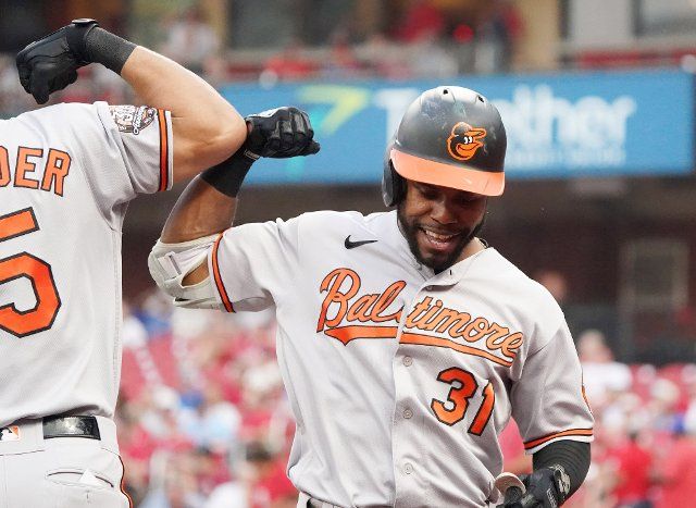 Baltimore Orioles Cedric Mullins is congratulated by teammate Anthony Santander after touching home plate, hitting a two run home run in the .third inning against the St. Louis Cardinals at Busch Stadium in St. Louis on Tuesday, May 10, 2022. Photo by Bill Greenblatt