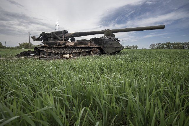 A destroyed Ukrainian 2S7 Pion (Peony), tank lies in a field from Russian shelling east of Kharkiv in Vilhivka, Ukraine, Saturday, May 14, 2022. Russian forces are retreating from the formerly occupied northern Ukrainian city of Kharkiv, military officials claimed Saturday, as Kyiv launched a counteroffensive in the nearby city of Izium. Photo by Ken Cedeno