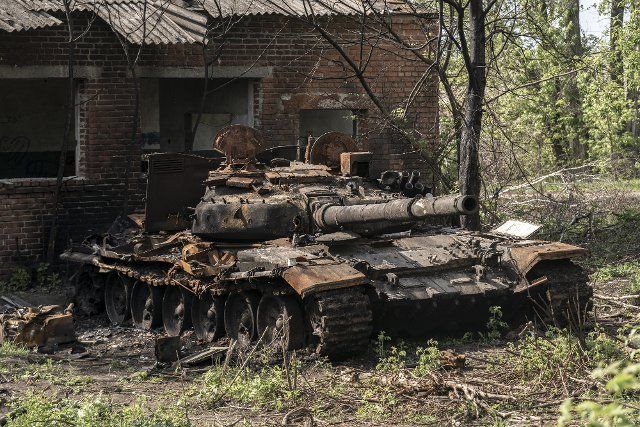 A destroyed Russian tanks sits near a home east of Kharkiv in Biskvitne, Ukraine, Saturday, May 14, 2022. Russian forces are retreating from the formerly occupied northern Ukrainian city of Kharkiv, military officials claimed Saturday, as Kyiv launched a counteroffensive in the nearby city of Izium. Photo by Ken Cedeno