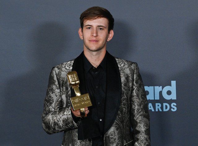 Illenium appears backstage with his award during the annual Billboard Music Awards held at the MGM Grand Garden Arena in Las Vegas on May 15, 2022. The musician was honored with Top Dance\/Electronic Album for "Fallen Embers". Photo by Jim Ruymen