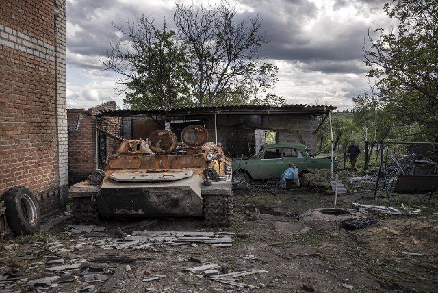 A Russian tank destroyed by Ukrainian Forces sits next to a house in a small town east of Kharkiv, in Vilhivka, Ukraine, Monday, May 16, 2022. Ukrainian forces said Monday their counteroffensive in the second-largest city of Kharkiv has allowed them to push back Russian forces in one of the most significant setbacks for Moscow since its invasion. Photo by Ken Cedeno