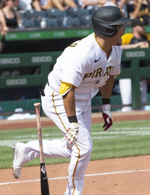Pittsburgh Pirates first baseman Yoshi Tsutsugo (25) singles in the bottom of the ninth inning driving home two runs to tie the score forcing extra innings in the Marlins 6-5 win at PNC Park on Sunday July 24, 2022 in Pittsburgh. Photo by Archie Carpenter
