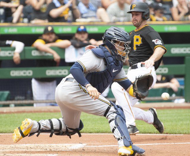 Pittsburgh Pirates catcher Jason Delay (61) is safe at home during the seventh inning of the 5-4 win against the Milwaukee Brewers at PNC Park on Thursday August 4, 2022 in Pittsburgh. Photo by Archie Carpenter