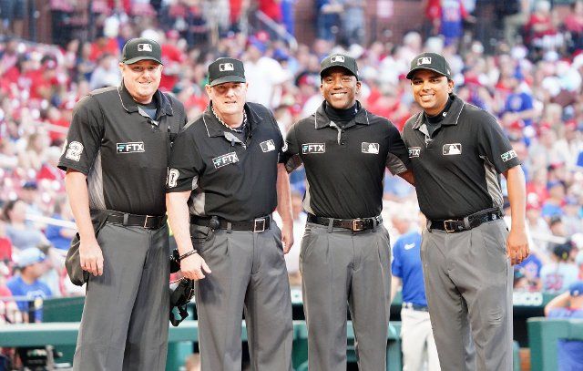 Umpire crew (L to R) Chad Whitson,Marty Foster, Malachi Moore and Erich Bacchus prepare to work the Chicago Cubs-St. Louis Cardinals baseball game at Busch Stadium in St. Louis on Thursday, August 4, 2022. Photo by Bill Greenblatt