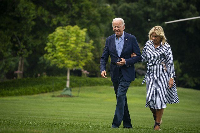 U.S. President Joe Biden and First Lady Jill Biden walk on the South Lawn of the White House after arriving on Marine One in Washington, DC on Monday, August 8, 2022. Biden resumed official travel today for the first time since his bout with Covid-19, traveling to Kentucky to show federal support for the state\