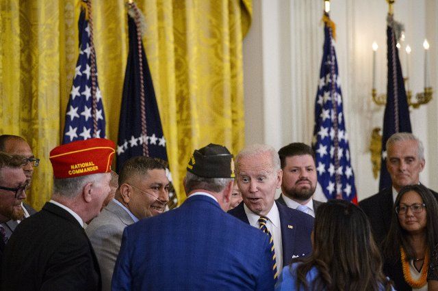 President Joe Biden greets veterans after signing the PACT Act of 2022, a bill to expand health care benefits for veterans exposed to toxic burn pits, in the East Room of the White House in Washington, DC on Wednesday, August 10, 2022. Photo by Bonnie Cash