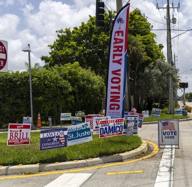 Early voting campaign signs are set at the entrance to the voting center at the Hagen Ranch Library in Delray Beach, Florida, on Wednesday, August 10, 2022. Early voting for the August 23, 2022 primary election started in Miami and Palm Beach counties on Monday , August 8,2022. Photo by Gary I Rothstein