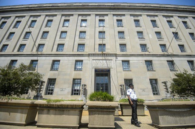 Security guard stands outside the Justice Department building in Washington, DC on Wednesday, August 10, 2022. The FBI executed a search warrant on August 9, 2022 of former President Donald Trump\