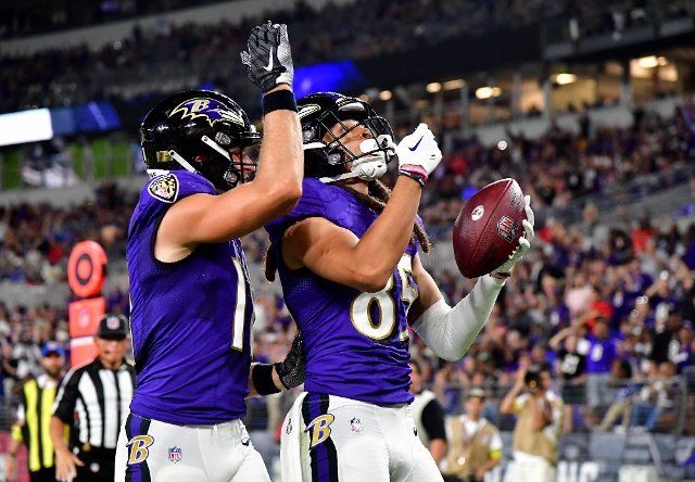Baltimore Ravens wide receiver Shemar Bridges (85) celebrates a 14 yard touchdown with teammate Raleigh Webb (11) during the first half of an NFL preseason game against the Tennessee Titans at M&T Bank Stadium in Baltimore, Maryland, on Thursday, August 11, 2022. Photo by David Tulis