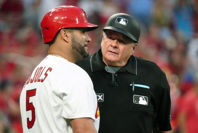 Home Plate Umpire Jerry Layne talks with St. Louis Cardinals Albert Pujols before the start of the Colorado Rockies-St. Louis Cardinals baseball game at Busch Stadium in St. Louis on Tuesday, August 16, 2022. Photo by Bill Greenblatt