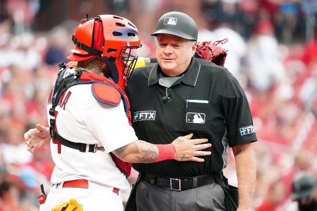 St. Louis Cardinals Catcher Yadier Molina says hello to home plate umpire Jerry Layne as he takes to the field for a game against the Colorado Rockies at Busch Stadium in St. Louis on Tuesday, August 16, 2022. Photo by Bill Greenblatt
