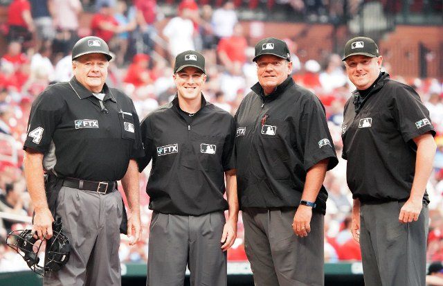 Umpire crew (L to R) Jerry Layne, Brennan Miller, Hunter Wendelstedt and Chad Whitson prepare to work the Colorado Rockies-St. Louis Cardinals baseball game at Busch Stadium in St. Louis on Tuesday, August 16, 2022. Photo by Bill Greenblatt