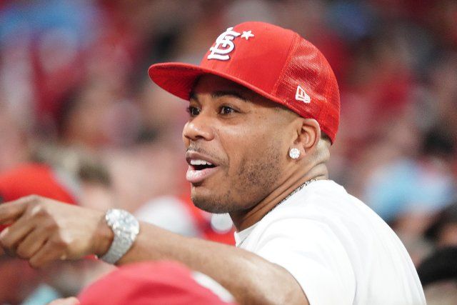 Rapper Nelly says hello to fans while attending the Colorado Rockies-St. Louis Cardinals baseball game at Busch Stadium in St. Louis on Tuesday, August 16, 2022. Photo by Bill Greenblatt