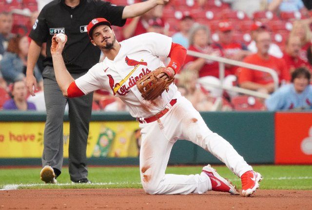 St. Louis Cardinals third baseman Nolan Arenado throws the baseball to first base from his knees to get Colorado Rockies Randal Grichuk in the second inning at Busch Stadium in St. Louis on Tuesday, August 16, 2022. Photo by Bill Greenblatt