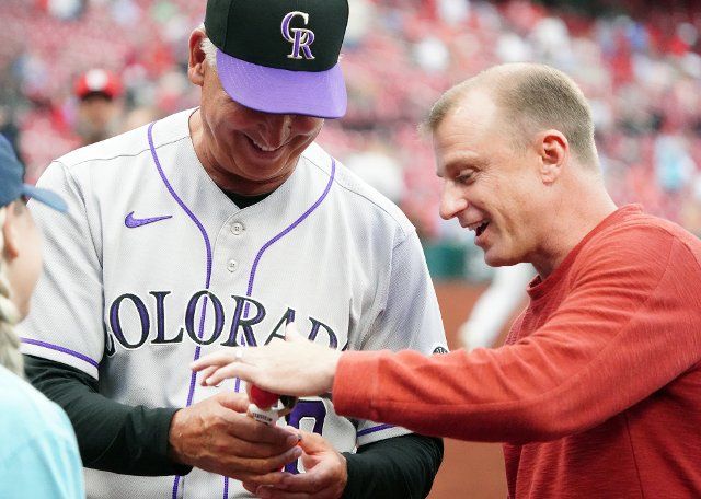Former St. Louis Cardinals David Eckstein shows off his Bobblehead that was given out, to Colorado Rockies Manager Bud Black before a game against the St. Louis Cardinals at Busch Stadium in St. Louis on Tuesday, August 16, 2022. Photo by Bill Greenblatt