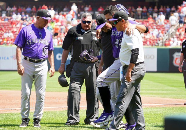 Colorado Rockies manager Bud Black and home plate umpire Hunter Wendelstedt watch as Rockies training staff help starting pitcher Antonio Senzatela off the field after being injured in the second inning against the St. Louis Cardinals at Busch Stadium in St. Louis on Thursday, August 18, 2022. Photo by Bill Greenblatt