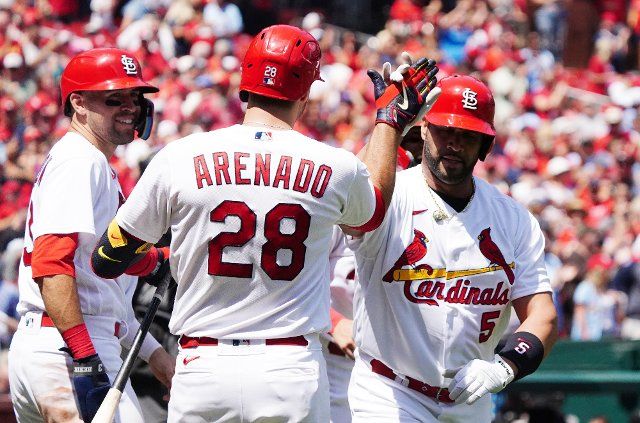 St. Louis Cardinals Albert Pujols slaps hands with Nolan Arenado after hitting career home run 690 in the third inning against the Colorado Rockies at Busch Stadium in St. Louis on Thursday, August 18, 2022.St. Louis defeated Colorado 13-0. Photo by Bill Greenblatt