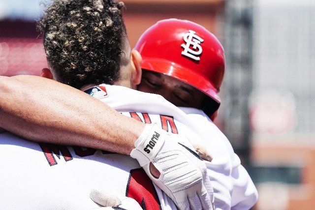 St. Louis Cardinals Albert Pujols hugs teammate Yadier Molina after hitting a grand slam home run in the third inning against the Colorado Rockies at Busch Stadium in St. Louis on Thursday, August 18, 2022.St. Louis defeated Colorado 13-0. Photo by Bill Greenblatt