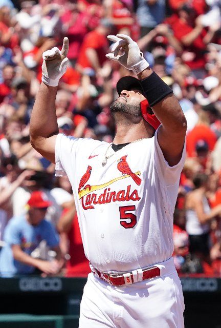 St. Louis Cardinals Albert Pujols looks skyward, touching home plate, after hitting career home run 690 in the third inning against the Colorado Rockies at Busch Stadium in St. Louis on Thursday, August 18, 2022.St. Louis defeated Colorado 13-0. Photo by Bill Greenblatt