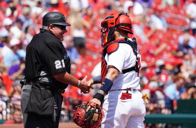 St. Louis Cardinals catcher Yadier Molina says hello to home plate umpire Hunter Wendelstedt before the start of a game against the Colorado Rockies at Busch Stadium in St. Louis on Thursday, August 18, 2022.St. Louis defeated Colorado 13-0. Photo by Bill Greenblatt