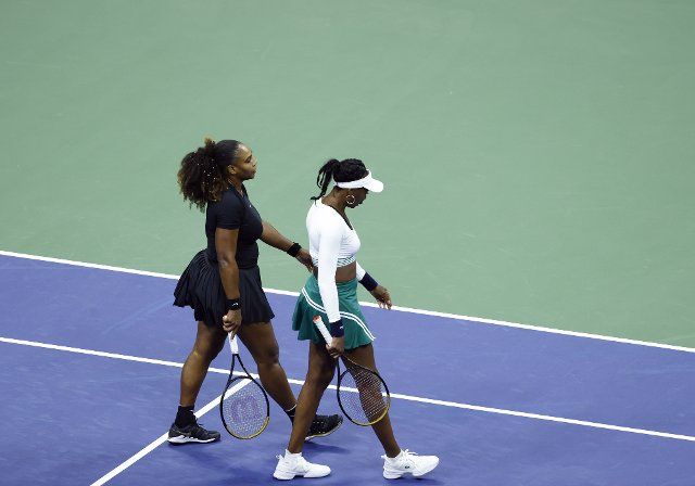 Serena Williams and Venus Williams walk off of the court for a change over in their first round doubles match against Lucie Hradecka of the Czech Republic and Linda Noskova of the Czech Republic at the 2022 US Open Tennis Championships in Arthur Ashe Stadium at the USTA Billie Jean King National Tennis Center in New York City, on Thursday, September 1, 2022. Photo by John Angelillo