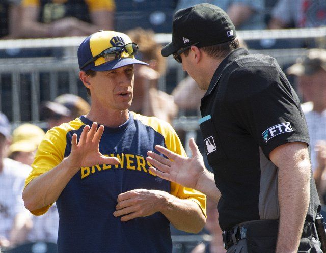 Milwaukee Brewers manager Craig Counsell (30) listens to the explanation of the call during the bottom on the ninth inning of the Brewers 2-0 win against the Pittsburgh Pirates at PNC Park on Sunday July 3, 2022 in Pittsburgh. Photo by Archie Carpenter