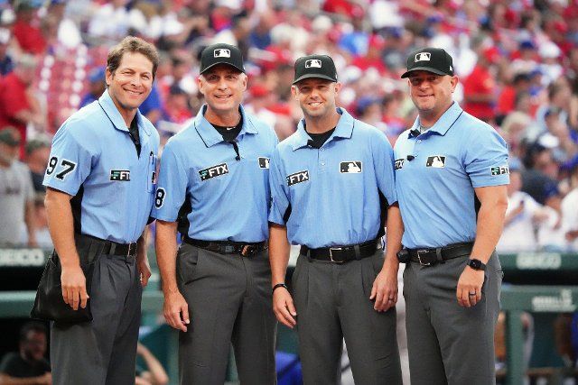 Umpire crew (L to R) Ben May, Dan Iassogna, Will Little and Scott Barry, pose for a photo at home plate before the Los Angeles Dodgers-St. Louis Cardinals baseball game at Busch Stadium in St. Louis on Thursday, July 14, 2022. Photo by Bill Greenblatt