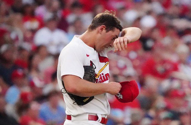 St. Louis Cardinals starting pitcher Andre Pallante steps off the mound for a moment to wipe his face after giving up two runs in the first inning to the Cincinnati Reds at Busch Stadium in St. Louis on Friday, July 15, 2022. Photo by Bill Greenblatt