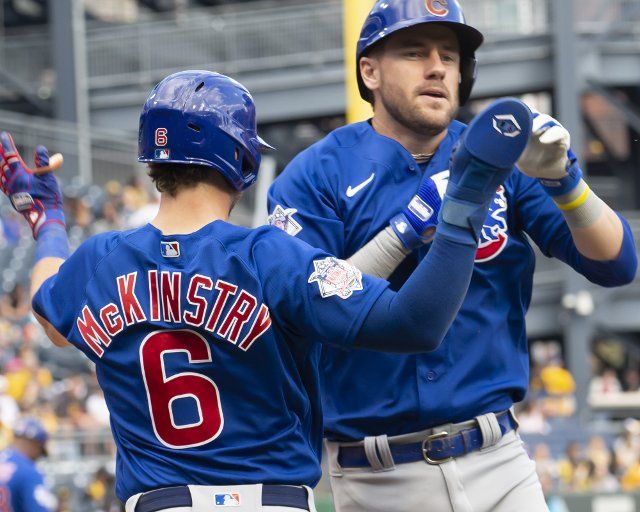 Chicago Cubs third baseman Patrick Wisdom (16) celebrates his three run homer with Chicago Cubs third baseman Zach McKinstry (6) in the fifth inning against the Pittsburgh Pirates at PNC Park on Sunday September 25, 2022 in Pittsburgh. Photo by Archie Carpenter