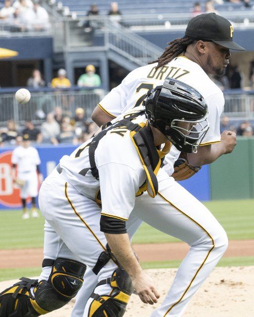 Pittsburgh Pirates catcher Jason Delay (61) receives an error after colliding with Pittsburgh Pirates starting pitcher Luis Ortiz (75) in the third inning against the Chicago Cubs at PNC Park on Sunday September 25, 2022 in Pittsburgh. Photo by Archie Carpenter