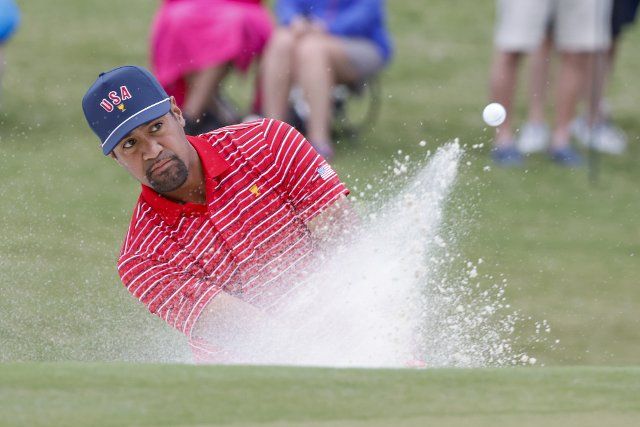 Tony Finau hits out of a bunker on the fourth hole at the Presidents Cup golf championship in Charlotte, North Carolina on Sunday, September 25, 2022. Photo by Nell Redmond
