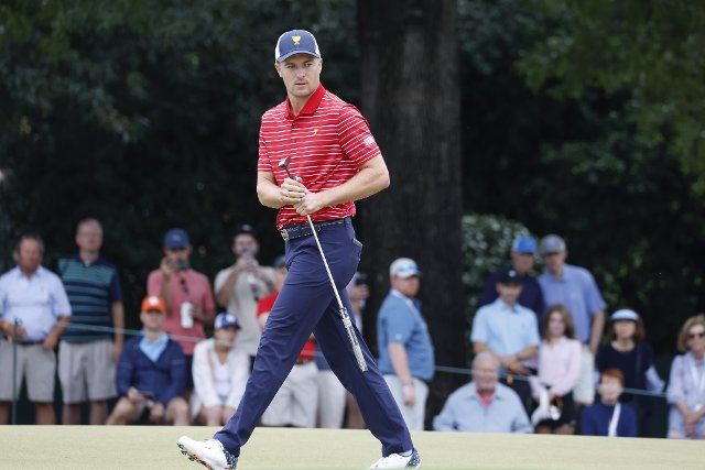 Jordan Spieth watches his putt on the third hole at the President\