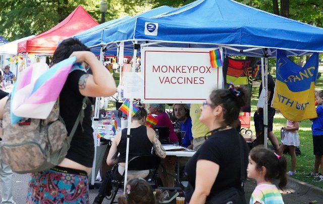 Signs attract visitors to a tent where the Monkeypox vaccine is being given during the Tower Grove Pride in St. Louis on Sunday, September 25, 2022. The festival includes drag and musical performances, hundreds of booths, and local food companies. Photo by Bill Greenblatt