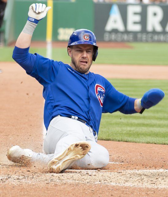 Chicago Cubs third baseman Patrick Wisdom (16) slides and scores during the seventh inning of the 8-3 Cubs win against the Pittsburgh Pirates at PNC Park on Sunday September 25, 2022 in Pittsburgh. Photo by Archie Carpenter