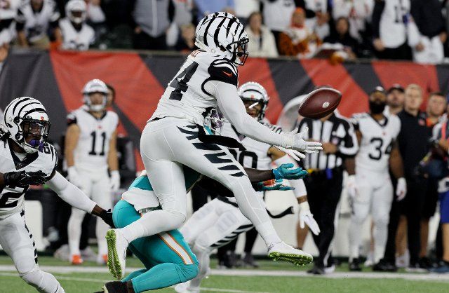 Cincinnati Bengals Vonn Bell (24) catches the interception from Miami Dolphins quarter back Tua Tagovailoa (1) during the first half of play at Paycor Stadium, Thursday, September 29, 2022 in Cincinnati, Ohio. Photo by John Sommers II