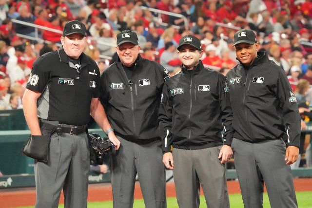 Umpire crew (L to R) Chris Conroy, Ron Kulpa, Randy Rosenberg and Jeremie Rehak, gather at home plate for a photo before working the Pittsburgh Piratres-St. Louis Cardinals baseball game at Busch Stadium in St. Louis on Friday, September 30, 2022. Photo by Bill Greenblatt