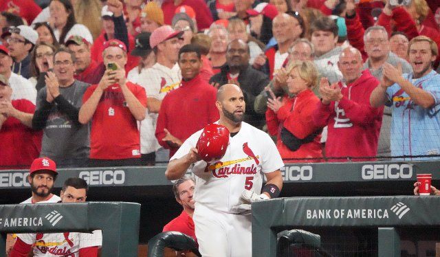 St. Louis Cardinals Albert Pujols comes out of the dugout, tiping his cap to the fans after hitting his 701th career home run, in the fourth inning aginst the Pittsburgh Pirates at Busch Stadium in St. Louis on Friday, September 30, 2022. Photo by Bill Greenblatt