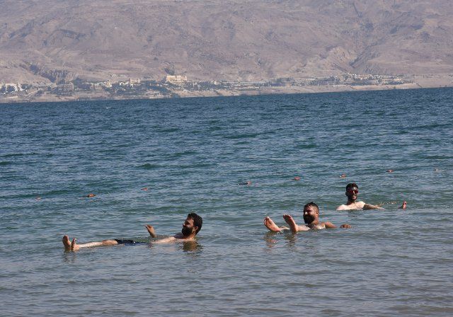 Palestinians enjoy the Dead Sea at the private beach of the Biankini Village Resort in the West Bank near Jericho, on Thursday, September 29, 2022. Israeli owner, Dina Dagan says 80% of her bookings are made through Booking.com and that she is seeing a drop in reservations since Booking.com, the online travel agency announced that it will add warnings to listings in the Israeli occupied West Bank, cautioning customers reserving accommodations in Israeli Settlements that they are traveling to a disputed high risk area. Israeli Tourism Minister Yoel Razvozov says he\