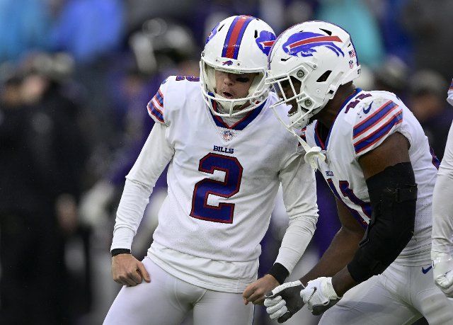 Buffalo Bills place kicker Tyler Bass (2) celebrates with fullback Reggie Gilliam (41) after a 21 yard game-winning field goal against the Baltimore Ravens as time expires during the second half at M&T Bank Stadium in Baltimore, Maryland, on Sunday, October 2, 2022. Buffalo won 23-20. Photo by David Tulis