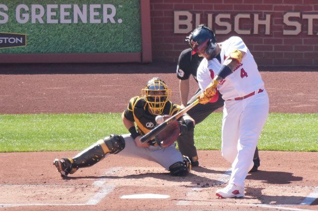 St. Louis Cardinals Yadier Molina swings, hitting a sacrifice RBI fly ball in the first inning against the Pittsburgh Pirates at Busch Stadium in St. Louis on Sunday, October 2, 2022. Photo by Bill Greenblatt