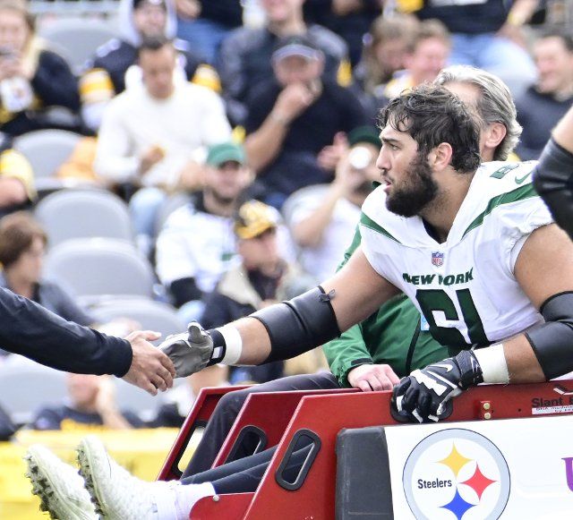 New York Jets offensive tackle Max Mitchell (61) is carted off the field with an injury during second quarter of the Jets 24-20 win against the Pittsburgh Steelers at Acrisure Stadium on Sunday, October 2, 2022 in Pittsburgh Photo by Archie Carpenter