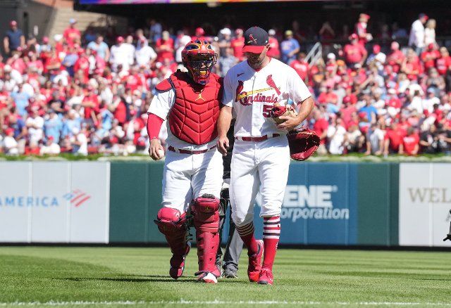 St. Louis Cardinals Yadier Molina and starting pitcher Adam Wainwright walk to the dugout from the bullpen before a game against the Pittsburgh Pirates at Busch Stadium in St. Louis on Sunday, October 2, 2022. Photo by Bill Greenblatt