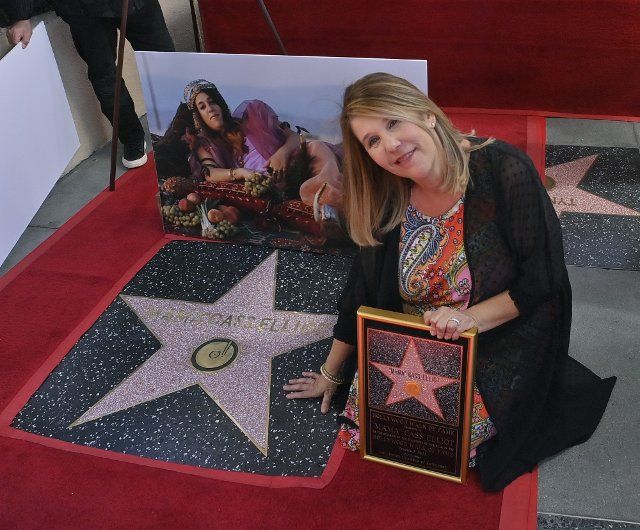 Owen Elliot-Kugell touches the star during the Hollywood Walk of Fame unveiling ceremony honoring her mother, the late singer "Mama" Cass Elliot posthumously with the 2,735th star in Los Angeles on Monday, October 3, 2022. Photo by Jim Ruymen