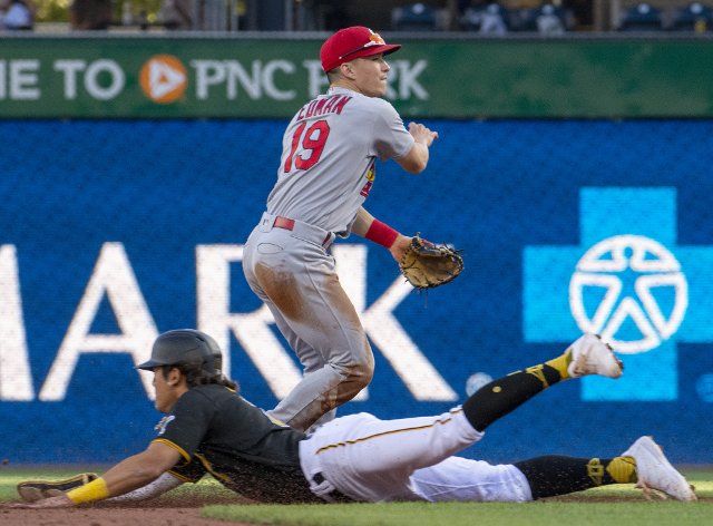 Pittsburgh Pirates second baseman Ji Hwan Bae (71) is safe at second base as St. Louis Cardinals second baseman Tommy Edman (19) throws to first during the third inning at PNC Park on Wednesday October, 5 2022 in Pittsburgh. Photo by Archie Carpenter