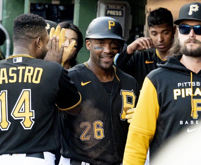 Pittsburgh Pirates left fielder Miguel Andujar (26) celebrates scoring in the fourth inning against the St. Louis Cardinals at PNC Park on Wednesday October, 5 2022 in Pittsburgh. Photo by Archie Carpenter