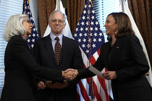 U.S. Vice President Kamala Harris (R) swears in Dr. Arati Prabhakar next to her husband Pat Henry Windham to be Director of the Office of Science and Technology Policy in the Ceremonial Office at the White House on Thursday, October 6, 2022. Photo by Yuri Gripas