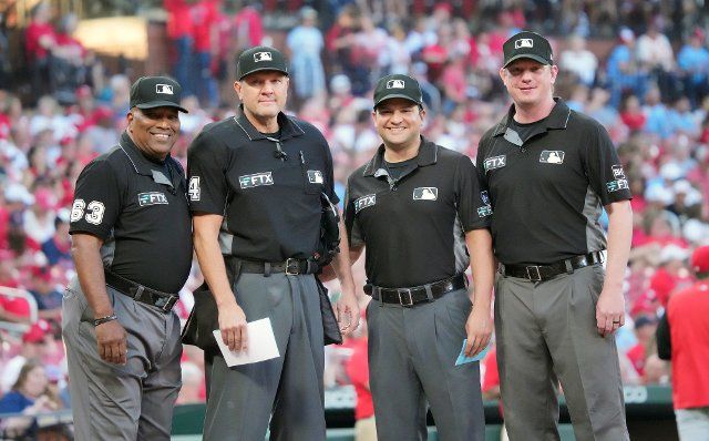 Umpire (L to R) Crew Chief Laz Dias, Chad Fairchild, Ryan Willis and Charlie Ramos gather for a photo before the start of the Cincinnati Reds-St. Louis Cardinals baseball game at Busch Stadium in St. Louis on Saturday, September 17, 2022. Photo by Bill Greenblatt